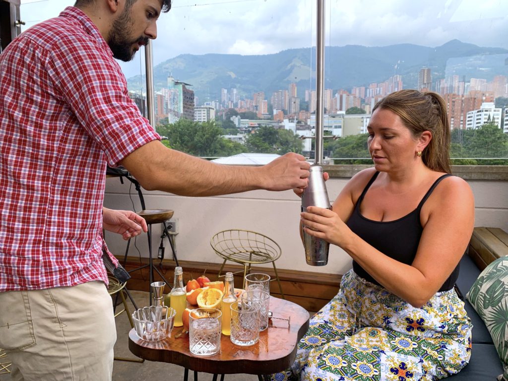 making cocktails with the help of a bartender